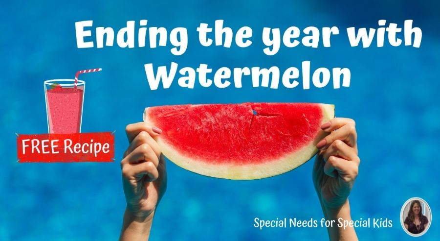 holding up a slice of watermelon