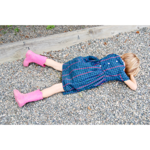 girl laying on ground